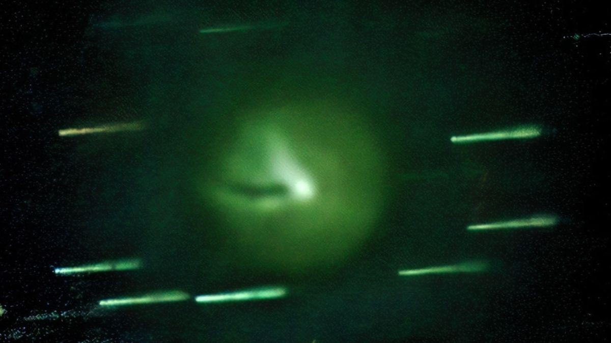 City-size 'devil comet' headed for Earth loses its iconic horns and turns green after latest volcanic eruption