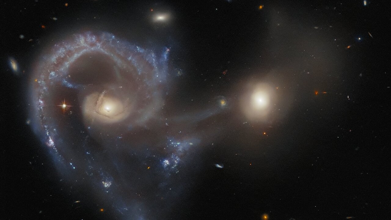 New Hubble image reveals intergalactic bridge between two merging realms