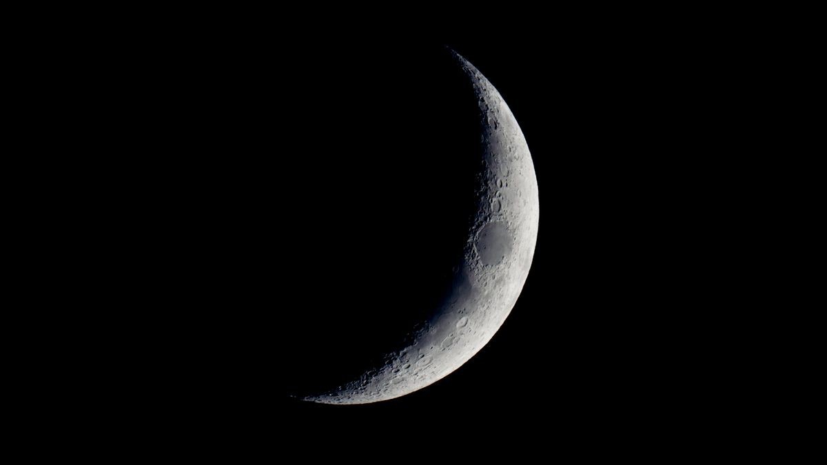 See a lunar scar darken the crescent moon tonight