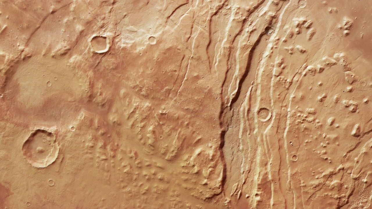 Mars orbiter looks deep into chasms and valleys on the Martian surface