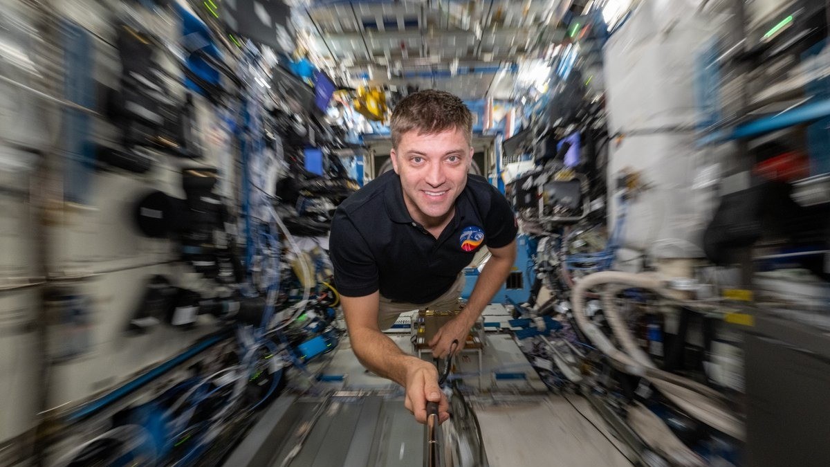 Streaks in space! ISS astronaut's incredible timelapse photos highlight ghostly solar panels and lovely star trails