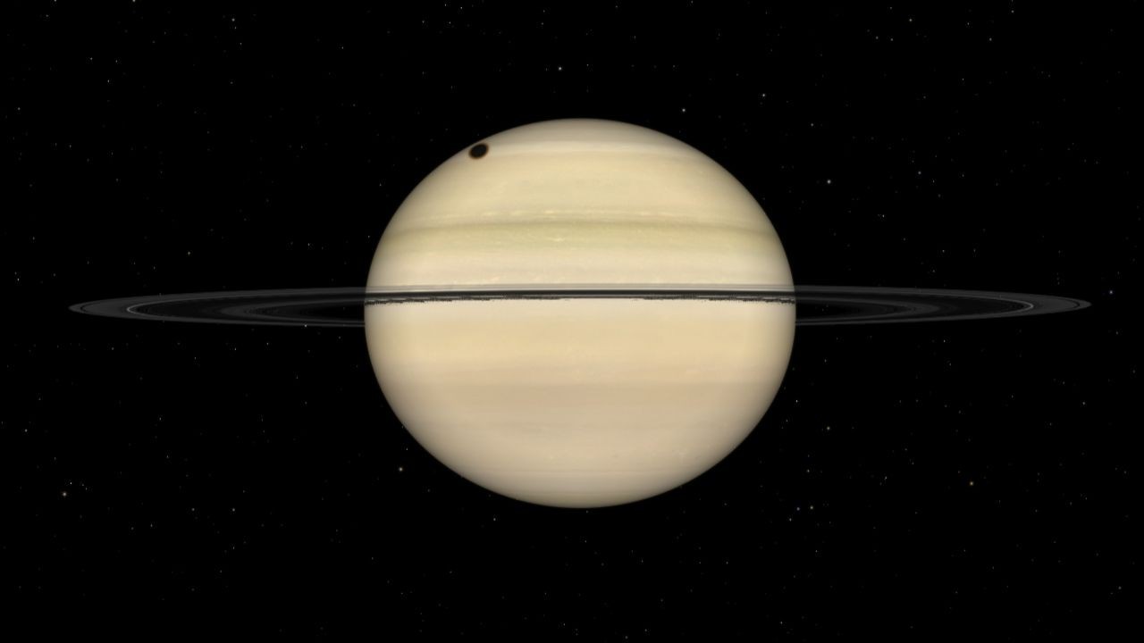 Colossal moon Titan casts a shadow on Saturn's cloud tops early on Sept. 4. Will you be able to see it?